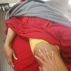Touched By An Angel Mobile Massage Therapy - Gentle touch to soothe tight quads from day to day activity.