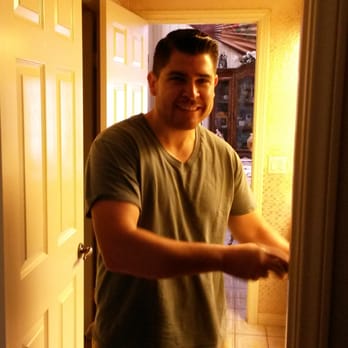 Interwest Electric - Jose posing for a smile while installing a Decora switch. - Electricians Near Me - San Diego, California Interwest Electric - Jose posing for a smile while installing a Decora switch. - Electricians Near Me - San Diego, California