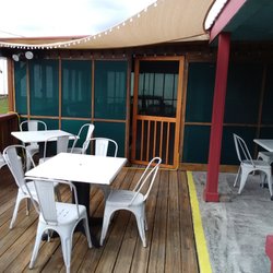 A Taste of Sunrise Coffee House - Outdoor patio with enclosed patio in the background