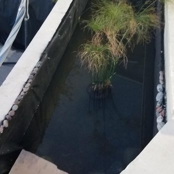 Pond Works - The crappy work of the landscaper I fired!!! Notice how low the water level sits & poor craftsmanship! - Landscaping Near Me