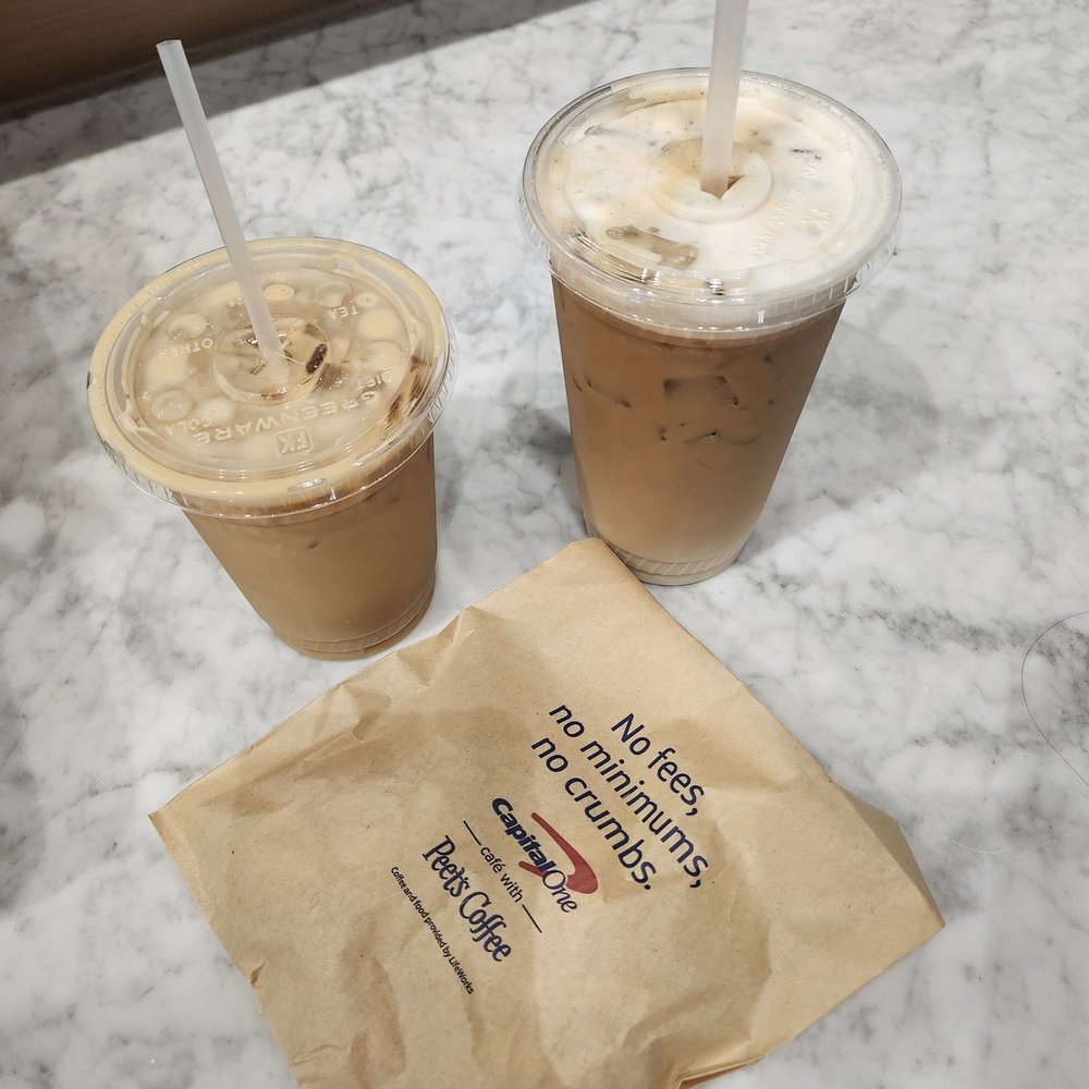 Capital One Café - Horchata oat milk latte on right. Oat milk vanilla latte on left with a croissant - Coffee & Tea Near Me - Austin, Texas Capital One Café - Horchata oat milk latte on right. Oat milk vanilla latte on left with a croissant - Coffee & Tea Near Me - Austin, Texas