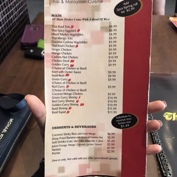 Thai One On - a hand holding a menu - Thai Near Me - Pickering, Ontario