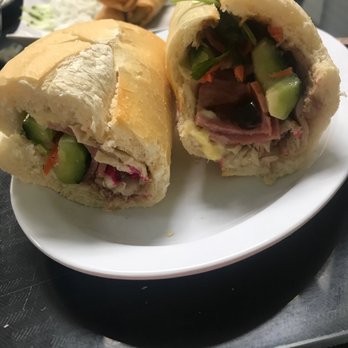 Pho Can Tho By 1 - Traditional banh mi with vegetable rolls in the background. - Vietnamese Near Me - Tucson, Arizona Pho Can Tho By 1 - Traditional banh mi with vegetable rolls in the background. - Vietnamese Near Me - Tucson, Arizona