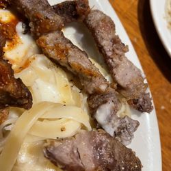 Johnny Carino's - Ribeye fat strips over Dollar Tree Alfredo