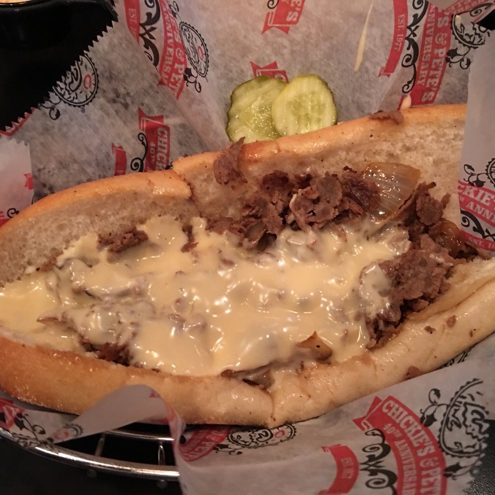 Chickie's & Pete's - Classic Philly cheesesteak with cheese sauce and fried onions - Seafood Near Me - Bensalem, Pennsylvania Chickie's & Pete's - Classic Philly cheesesteak with cheese sauce and fried onions - Seafood Near Me - Bensalem, Pennsylvania