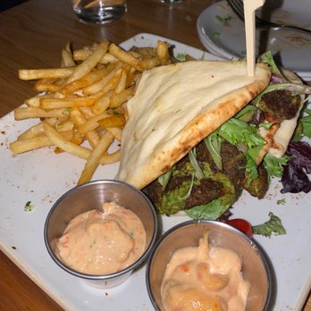 One Twenty Three Tavern - Red Lentil Falafel Wrap with California Garlic Fries - New American Near Me - Grand Rapids, Michigan One Twenty Three Tavern - Red Lentil Falafel Wrap with California Garlic Fries - New American Near Me - Grand Rapids, Michigan