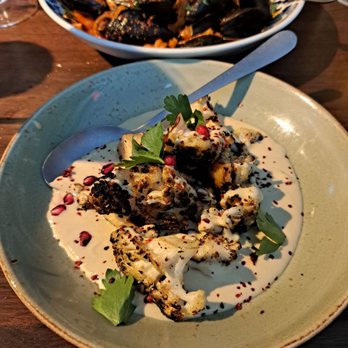 Riserva Bar + Tapas - Another shot of the cauliflower and mussels. Notice these tapas aren't skimpy on the portion size! - Tapas Bars Near Me - Oklahoma City, Oklahoma Riserva Bar + Tapas - Another shot of the cauliflower and mussels. Notice these tapas aren't skimpy on the portion size! - Tapas Bars Near Me - Oklahoma City, Oklahoma