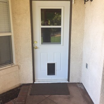 Don's Residential Doors - New door with window and doggie door after (exterior). - Door Sales/Installation Near Me