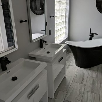 CMK Corporation - a bathroom with a tub, sink, and mirror - General Contractors Near Me - Tyrone, Georgia CMK Corporation - a bathroom with a tub, sink, and mirror - General Contractors Near Me - Tyrone, Georgia