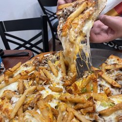 Brother Bruno's Pizza, Deli & Bagels - Cheese stake, fries, pasta and mozzarella sticks on a pizza!