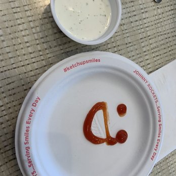 Johnny Rockets - The plate was a cute :-) drawn on with catchup. For us to for more catch up on for our fries. - Burgers Near Me - Lehi, Utah