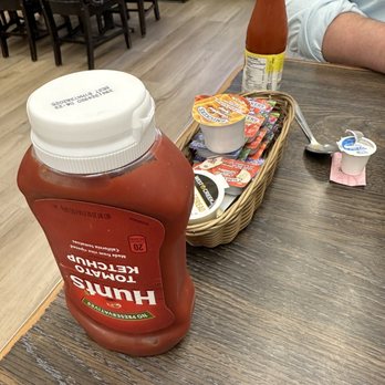 Moose's by the Creek - Ready for breakfast with syrup, hot sauce, ketchup, jams and butter - Breakfast & Brunch Near Me - Charlottesville, Virginia Moose's by the Creek - Ready for breakfast with syrup, hot sauce, ketchup, jams and butter - Breakfast & Brunch Near Me - Charlottesville, Virginia