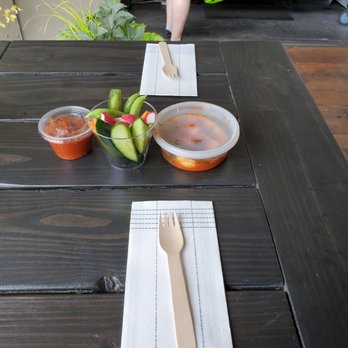 Fast Penny Spirits - Americano counter display with pop-up wares from JinjjaSeattle: Ponytail radish kimchi Samjang dipping sauce   Fresh veggies - Distilleries Near Me - Seattle, Washington