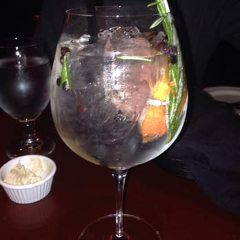 Redwood Cafe - Gin and Tonic-Sloane's dry gin, fever tree tonic water, grapefruit, rosemary,& juniper berries. - New American Near Me - Modesto, California Redwood Cafe - Gin and Tonic-Sloane's dry gin, fever tree tonic water, grapefruit, rosemary,& juniper berries. - New American Near Me - Modesto, California