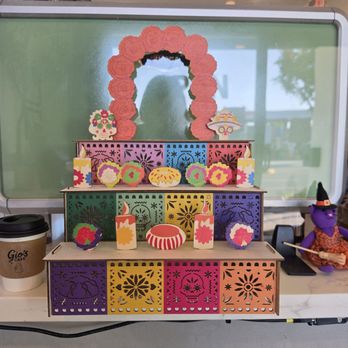Gio's Café - Cute Ofrenda and Halloween decorations welcoming you at the entrance. My cappuccino photo-bombed. - Coffee & Tea Near Me - Inglewood, California