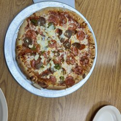 Riverside Restaurant - Medium pizza with pepperoni, sausage, green chile, and feta. Great and fresh.