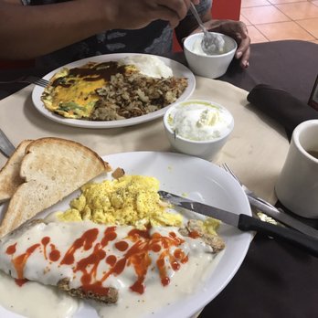 The Breakfast Place - Chicken fried steak brkfst (lil hot sauce drizzled) w/ soft scrambled eggs w/ cheese, toast (which tasted like sourdough bread, yum) & grits - Breakfast & Brunch Near Me - Spring, Texas The Breakfast Place - Chicken fried steak brkfst (lil hot sauce drizzled) w/ soft scrambled eggs w/ cheese, toast (which tasted like sourdough bread, yum) & grits - Breakfast & Brunch Near Me - Spring, Texas