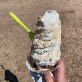 The DoughCone - Vanilla Ice-cream in a signature doughcone with churro dust and sprinkles. Already a few licks in and it's so good! - Food Trucks Near Me The DoughCone - Vanilla Ice-cream in a signature doughcone with churro dust and sprinkles. Already a few licks in and it's so good! - Food Trucks Near Me