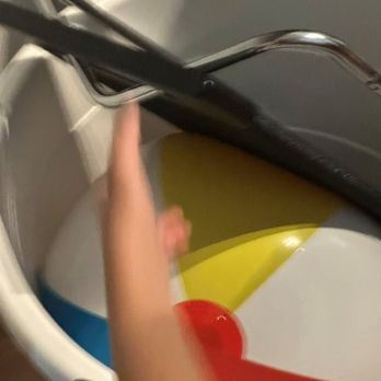 Prince Movers - Damaged toy bin and child's ball packed with heavy metal and wood foot rest. - Movers Near Me