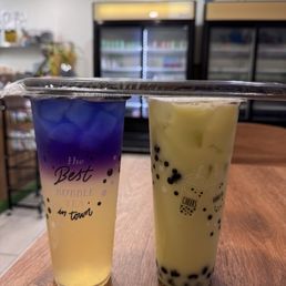 House-made lemonade and honeydew green milk tea with boba.