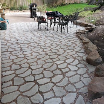 Angel's Landscaping - a patio with a table and chairs - Landscaping Near Me Angel's Landscaping - a patio with a table and chairs - Landscaping Near Me