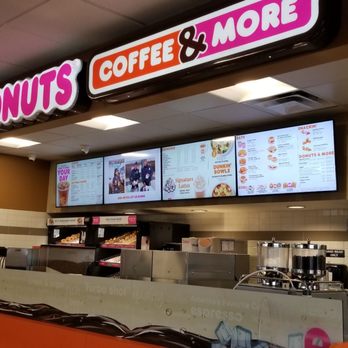 Dunkin' -  a man standing in front of a donut shop - Donuts Near Me - Wells, Nevada