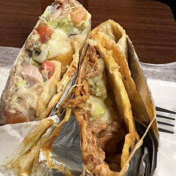 Maria's Taqueria - Chicken quesadilla half on the left. Carnitas on the right. Both with guacamole. $10 for a whole quesadilla, each. Very good! - Mexican Near Me - Boston, Massachusetts