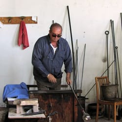 Murano Venetian Glass Center - He starts to shape it and blows to create a bubble.