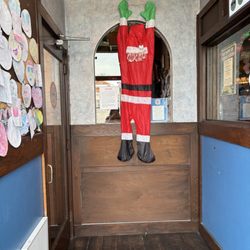 Blue Moon Mexican Café - Santa hanging out in the entryway