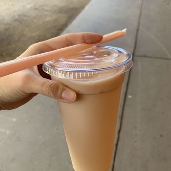 Jamba - a hand holding a plastic cup of jamba juice - Juice Bars & Smoothies Near Me - Stanford, California