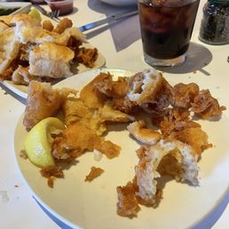 Here is the fish and chips just breading waiter never cleared the plates never asked how food was never filled drinks where is the staff?