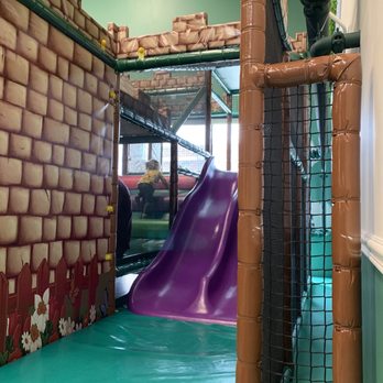 Kidcadia Play Café - Toddler area has a ramp to climb, a couple slides and a spinning pole hidden behind the slide. - Cafes Near Me - Dearborn, Michigan Kidcadia Play Café - Toddler area has a ramp to climb, a couple slides and a spinning pole hidden behind the slide. - Cafes Near Me - Dearborn, Michigan