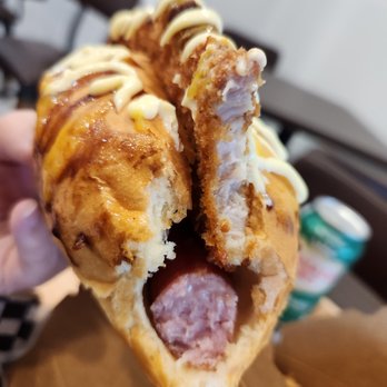 Aji Dog - a hand holding a hot dog - Hot Dogs Near Me - Burnaby, British Columbia Aji Dog - a hand holding a hot dog - Hot Dogs Near Me - Burnaby, British Columbia