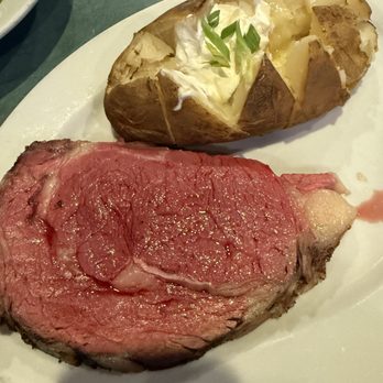 Doherty's Irish Pub & Restaurant - Cary - Prime rib with baked potato served mid rare and have leftovers - Irish Pub Near Me - Cary, North Carolina