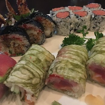 Corner Sushi - A beautiful green/white wrapper on the Three Stooges Roll. - Sushi Bars Near Me - St. Augustine, Florida