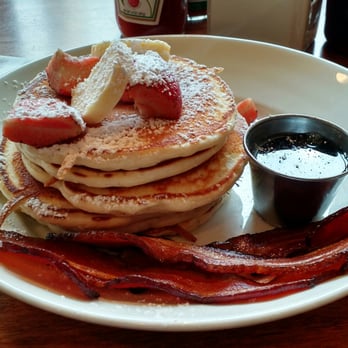 Marigold Kitchen - Stack of six fluffy pancakes from Marigold Kitchen. - Breakfast & Brunch Near Me - Madison, Wisconsin