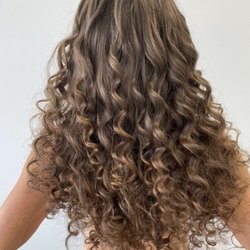 Custom curly extensions using the natural beaded row technique.