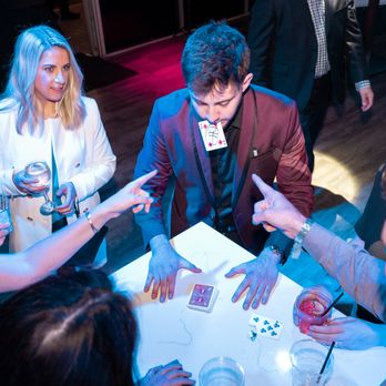 Danny H Magician - Performing close-up magic at a corporate event! - Magicians Near Me Danny H Magician - Performing close-up magic at a corporate event! - Magicians Near Me