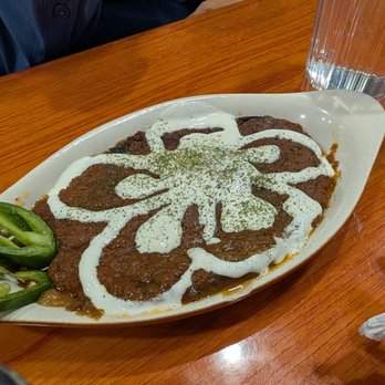 DeAfghanan Cuisine - Bodinjon Borani Roasted eggplant topped with garlic sour cream and dried mint served with Afghan bread. - Afghan Near Me - Fremont, California