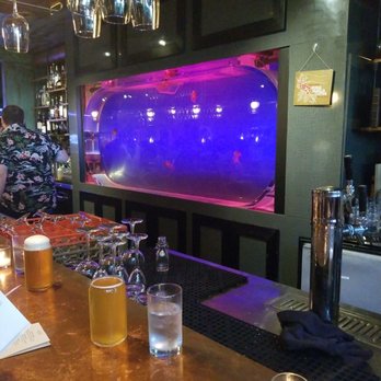 Lechon - Jelly fish tank behind the bar - Tapas Bars Near Me - Portland, Oregon