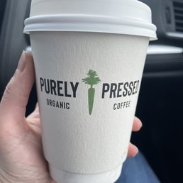 a person holding a cup of coffee a person holding a cup of coffee