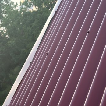 Region Roofing - panel not installed correctly and bowing between the screws - Roofing Near Me