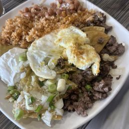 Asada Chilaquiles w/ eggs on the side Asada Chilaquiles w/ eggs on the side