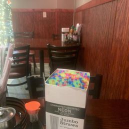 Boxes of in wrapped straws opened on every table