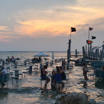 Seacrets - Sunset and water seating on the sound - Bars Near Me - Ocean City, Maryland