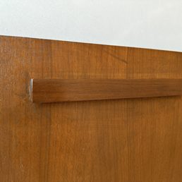 Brushstrokes in finish and imperfection from dripping lacquer