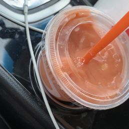 a plastic cup with a straw in it