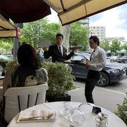 On the terrace. Good being served to the table next door. On the terrace. Good being served to the table next door.