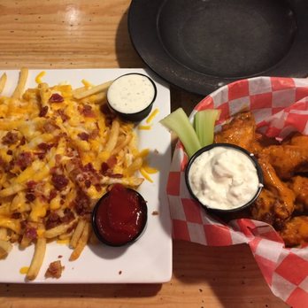 Jumby Bay Island Grill - Spicy chicken wings and loaded fries - Seafood Near Me - Jupiter, Florida Jumby Bay Island Grill - Spicy chicken wings and loaded fries - Seafood Near Me - Jupiter, Florida