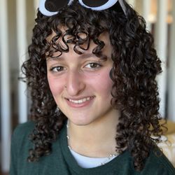 Salon Nuuvo - layered curly haircut with bangs